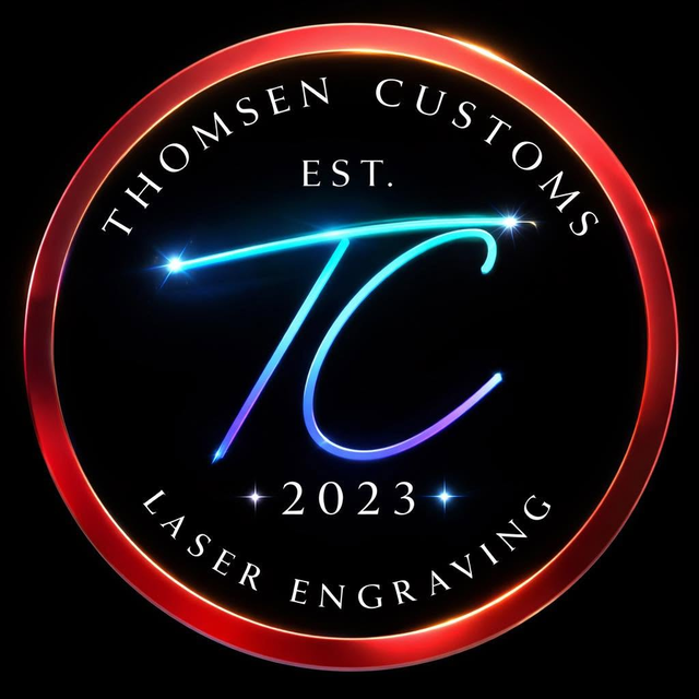 The Thomsen Customs mark: a crimson ring around a black field, THOMSEN CUSTOMS arced above a calligraphic TC monogram, EST 2023 and LASER ENGRAVING.